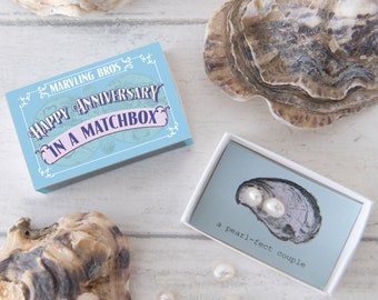 Happy Anniversary message and two freshwater pearls In A Matchbox