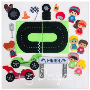 May include: A felt play set for children featuring a race track, two race cars, a finish line, traffic lights, and finger puppets of people wearing racing gear. The set is green, black, red, and grey.