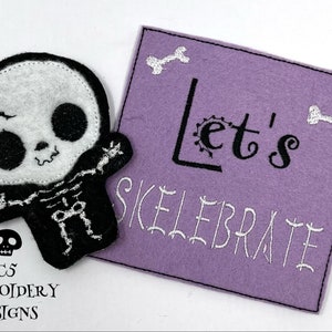 May include: A purple felt patch with white embroidery that reads "Let's Skelebrate" with two white bone designs. A small black and white felt skeleton applique is to the left of the patch.