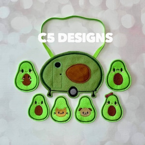 May include: A set of felt avocado-shaped patches with various designs, including a camper, a cat, a dog, and a smiling avocado. The patches are green with brown details and have a cute, cartoon-like style. The text "C5 DESIGNS" is visible at the top of the image.