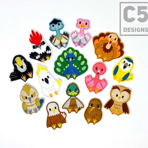 May include: A set of 13 colorful embroidered iron-on patches featuring different bird designs. The patches include a toucan, peacock, owl, duck, flamingo, ostrich, turkey, eagle, kiwi, and more.