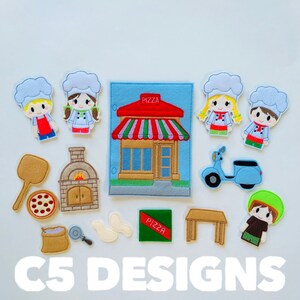 May include: Felt play set with a pizza shop, a pizza oven, a pizza, a table, a scooter, and five felt figures of people wearing chef hats. The text "PIZZA" is on the shop and a sign.