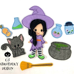May include: A felt applique set featuring a witch doll with a purple dress, black hair, and a purple hat. The set also includes a black cat, a cauldron, a broom, and several bottles of potion.