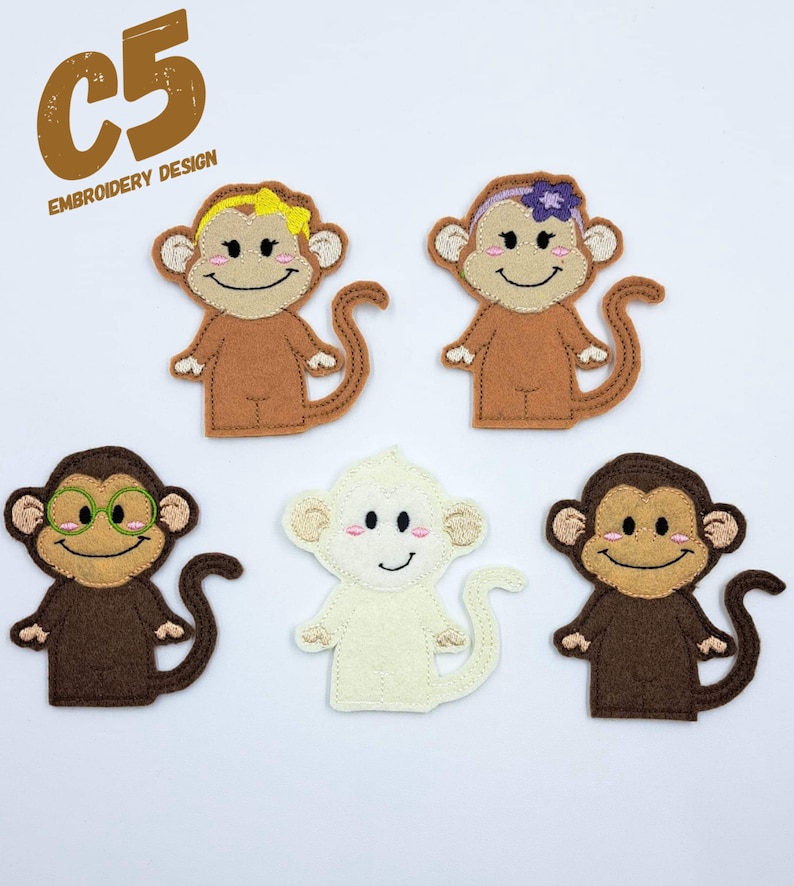 May include: Five felt monkey finger puppets. One monkey is brown with green glasses, one is brown with a yellow bow, one is brown with a purple flower, one is white, and one is brown.