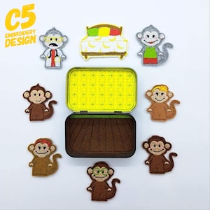 May include: A set of felt finger puppets in a tin box. The puppets include a doctor monkey, a monkey in a green dress, a monkey with a yellow bow, a monkey with red hair, a monkey with glasses, and a bed with bananas. The tin box has a yellow and green floral pattern on the lid and a brown felt interior.