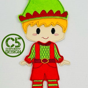 May include: A felt applique of a Christmas elf with a green hat, red and green striped shirt, red pants, and green shoes. The elf has a smiling face with blonde hair.