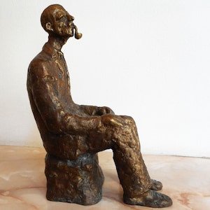 Bronze sculpture, statuette of an old man with a pipe