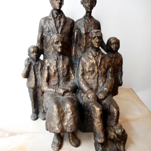 Realistic sculpture. Bronze statuette of a family