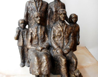 Realistic sculpture. Bronze statuette of a family