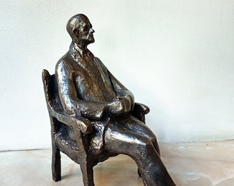 Realistic bronze sculpture, a bronze statuette of seated elderly man