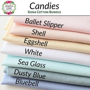 May include: A stack of seven fabric swatches in various shades of pink, yellow, white, blue, and light blue. The swatches are labeled with the names "Ballet Slipper", "Shell", "Eggshell", "White", "Sea Glass", "Dusty Blue", and "Bluebell". The text "Candies Kona Cotton Bundle" is at the top of the image.
