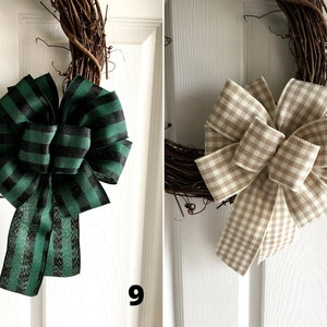 May include: Two decorative grapevine wreaths with large bows. One bow is green and black plaid, and the other is tan and white gingham. The wreaths are hanging on a white door. Numbers 9 and 10 are visible.