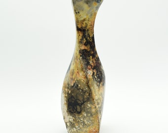 Pit fired ceramic vase with twisted form