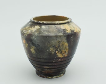 Pit fired ceramic vase titled "Chimaera"