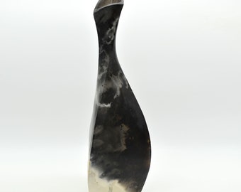 Tall pit fired vase with twisted form