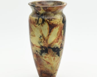 Pit fired vase with leaf motif