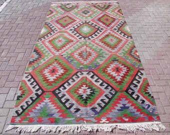 Handwoven Wool Turkish Kilim Rug: Green Boho Area Carpet (5.5 x 10.1 ft)