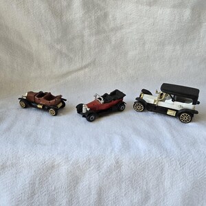 Three small vintage toy cars