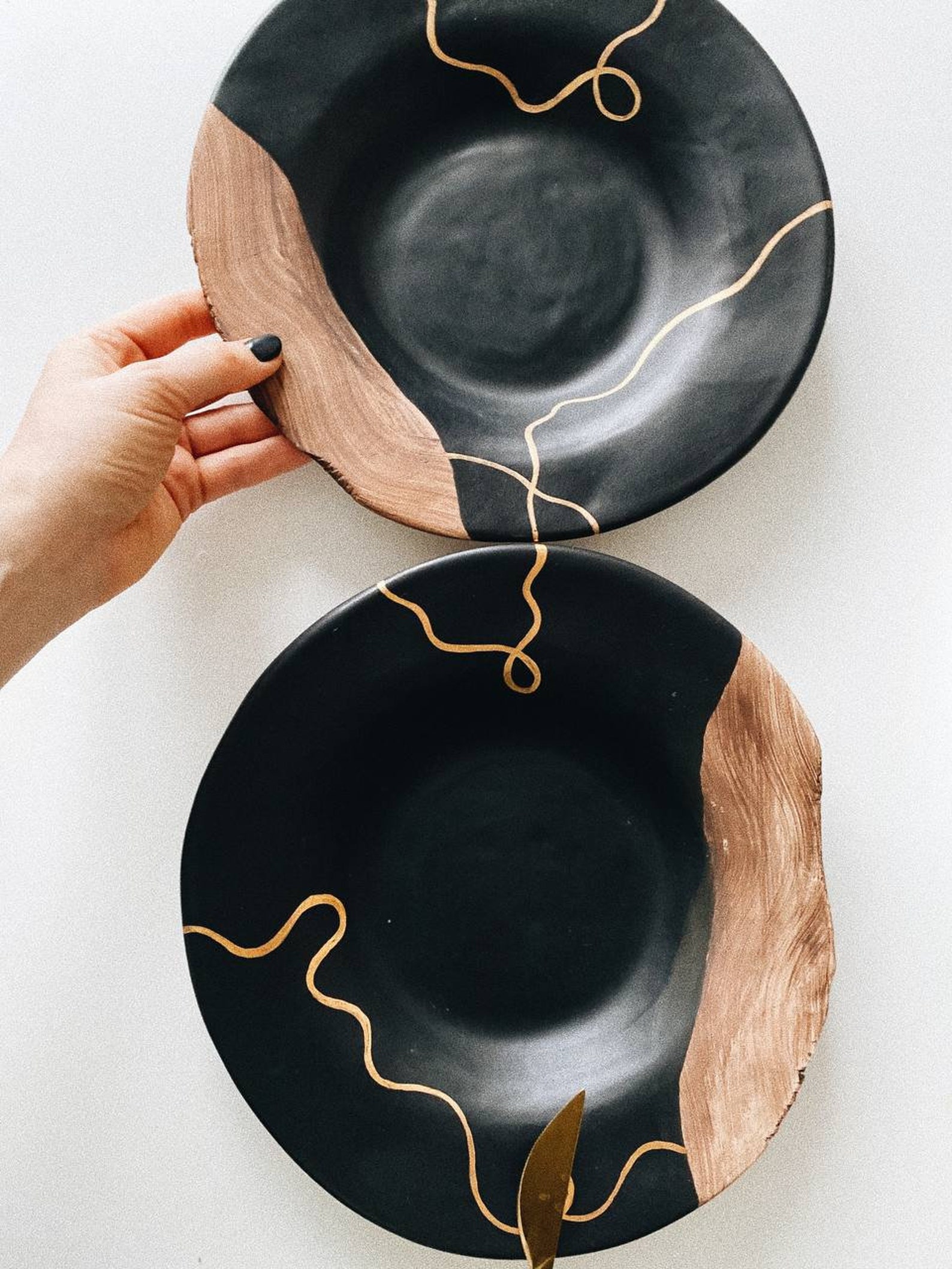 One black plate with golden painting and ceramic unglazed Etsy