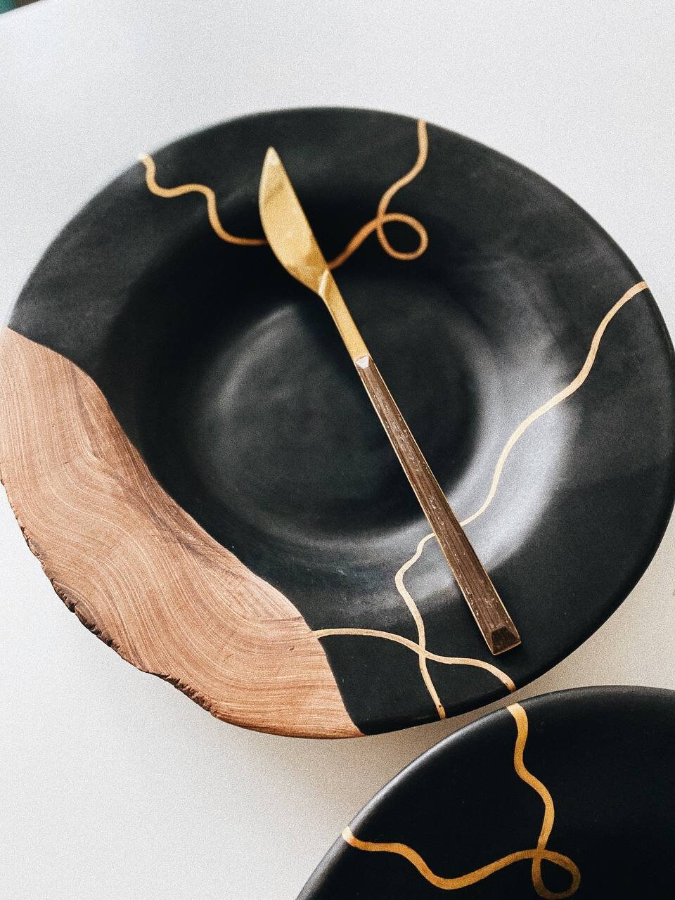 One black plate with golden painting and ceramic unglazed Etsy