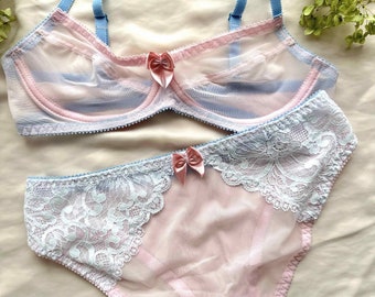 Sheer pale pink panties with blue lace.