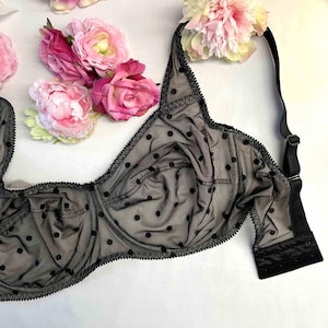 May include: Black polka dot bra with adjustable straps and a black lace trim.