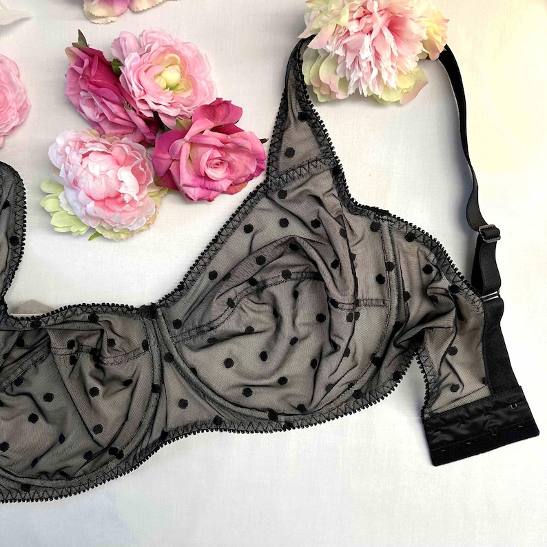 May include: Black polka dot bra with adjustable straps and a black lace trim.