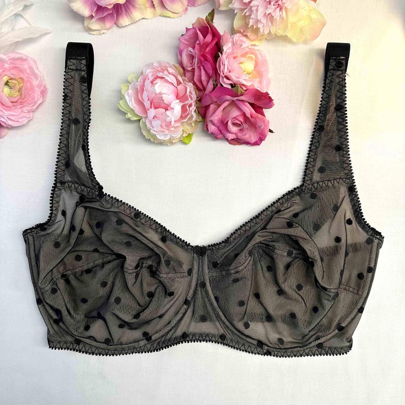 May include: Black polka dot mesh bra with adjustable straps.