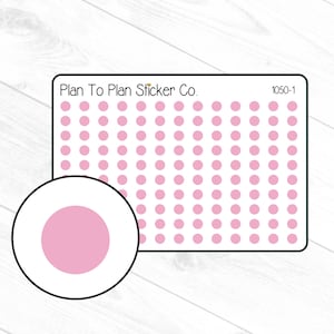 May include: A sheet of pink dot stickers with the text "Plan To Plan Sticker Co." and "1050-1" in the top corners. A single pink dot sticker is shown separately.