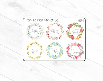 May include: Six floral wreath stickers with the months of the year written inside. The wreaths are in different colors, including yellow, pink, blue, and green. The text inside the wreaths says "Hello January", "Hello February", "Hello March", "Hello April", "Hello May", and "Hello June".