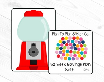May include: A red gumball machine with a clear bubble and a silver coin slot. A sticker with colorful dots and the text "Plan To Plan Sticker Co. 52 Week Savings Plan Goal $ 1064-2" is next to the gumball machine.
