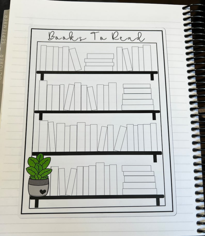 May include: A black and white printable bookshelf with the text "Books To Read" at the top. The bookshelf has four shelves with blank spaces for writing in the titles of books. A small potted plant with green leaves is on the bottom shelf.