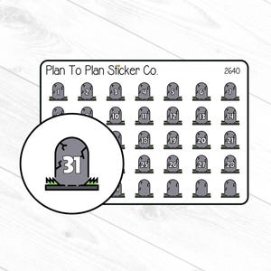 May include: A sheet of stickers from Plan To Plan Sticker Co. featuring tombstone designs with numbers 1-31. The stickers are gray with green grass at the base. A circular inset highlights the number 31 on a tombstone.