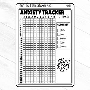 May include: Black and white anxiety tracker sticker with a color key for tracking anxiety levels. The sticker has a grid with 31 days and 12 months. The color key includes the following levels: none, low, medium, high, and severe.