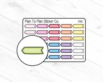 Può includere: Un foglio di adesivi per planner colorati con una varietà di forme e dimensioni. Gli adesivi sono disposti in righe e colonne e presentano una varietà di colori, tra cui rosa, blu, giallo e verde. Gli adesivi sono etichettati "Plan To Plan Sticker Co." e "2462".