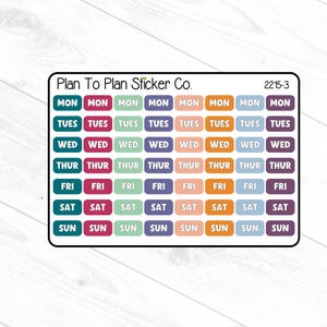 May include: A rectangular sheet of planner stickers labeled Plan To Plan Sticker Co. 2215-3, featuring eight columns of daily labels from Monday to Sunday in teal, magenta, light green, purple, peach, orange, light blue, and dark purple colors.