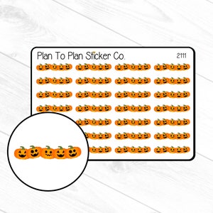 May include: A sheet of 60 orange and black jack-o'-lantern stickers. The stickers are arranged in rows of five. The sheet is labeled "Plan To Plan Sticker Co." and "2111".