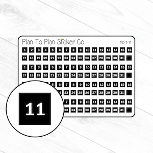 May include: Black and white sticker with the number 11 in a white square. The sticker is part of a larger sheet with a calendar grid for the month of November 1921. The sheet is labelled "Plan To Plan Sticker Co."