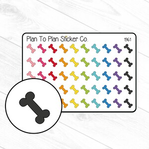 May include: A sheet of colorful dog bone stickers with a single black dog bone sticker in a white circle. The sheet has the text "Plan To Plan Sticker Co." and "1961" on it.