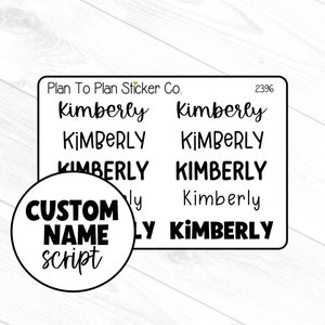 May include: A sheet of custom name stickers with the name "Kimberly" in various fonts. The stickers are black and white, with the text "Custom Name Script" in a circular design. The stickers are designed for planners and crafts.