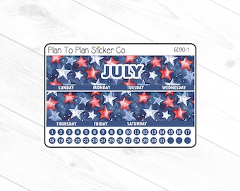 May include: A July planner sticker with a patriotic theme. The sticker features a blue watercolor background with red and white stars. The days of the week and dates are displayed, with the word "JULY" in large white letters.