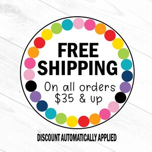 May include: A circular graphic with a black border and the words "FREE SHIPPING" in bold, black letters. The text "On all orders" and "& up" are below. A colorful ring of dots surrounds the text. The words "DISCOUNT AUTOMATICALLY APPLIED" are at the bottom.
