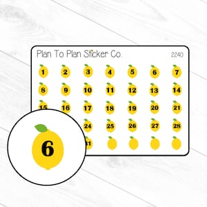 May include: A sheet of 28 lemon-shaped stickers with numbers 1 through 28. The stickers are yellow with green leaves and black numbers. The sheet is labeled "Plan To Plan Sticker Co." and "2240".