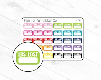 May include: A sheet of colorful stickers with the text "LBS LOST" in white lettering. The stickers are in various colors, including pink, red, orange, yellow, green, blue, and purple. The stickers are arranged in a grid pattern.