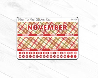 May include: A November calendar sticker with a plaid pattern in red, yellow, green, and brown. The sticker has the days of the week and numbers 1 through 31.