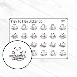 May include: A sheet of 27 planner stickers featuring a white bear wearing a pink headband and holding a book. The stickers are designed for use in a planner or journal. The text "Plan To Plan Sticker Co." and "27/10" are printed on the sheet.