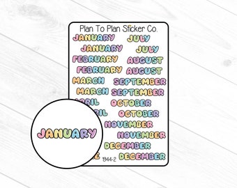 May include: A sheet of colorful stickers with the months of the year written in a playful font. The stickers are perfect for planners, journals, and other paper crafts.
