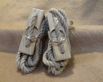 Two are pictured but this price is for a single rope. Single tent ropes,8mm hemp rope with oak pulls 10’ long overall.