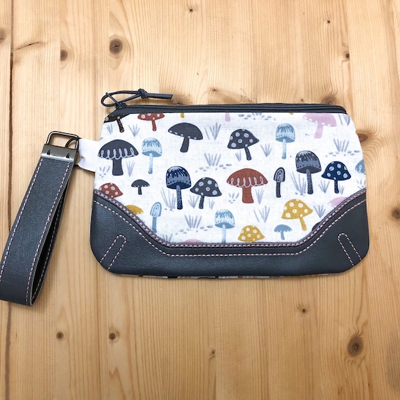 Pouch with wrist clearance strap