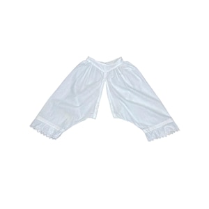 May include: A pair of white open-crotch bloomers featuring a gathered waistband and leg openings finished with delicate white lace trim. The garment is constructed from a lightweight fabric and displays a split design at the center front.